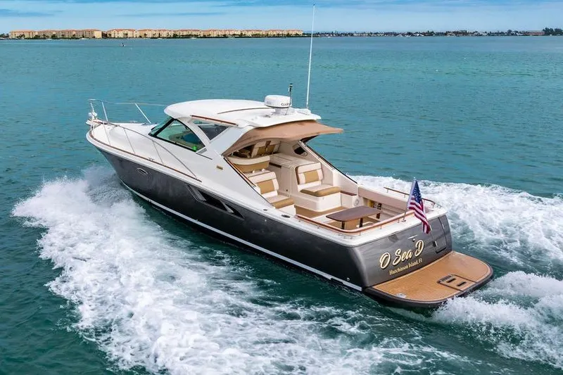 Slide: The Image of 2013 Tiara Yachts 3600 Coronet cruising on open water, rear view. - 41