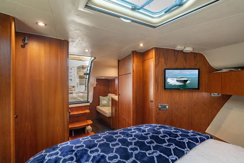 Slide: The Image of Luxurious interior of 2013 Tiara Yachts 3600 Coronet with wood paneling and cozy seating. - 6