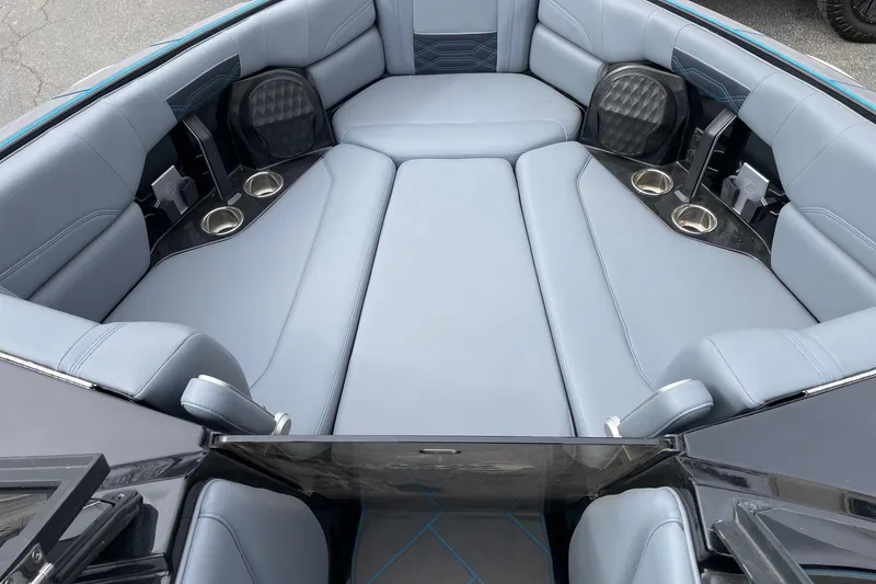 Slide: The Image of 2024 Malibu Wakesetter 26 LSV interior with luxurious seating and cup holders. - 12