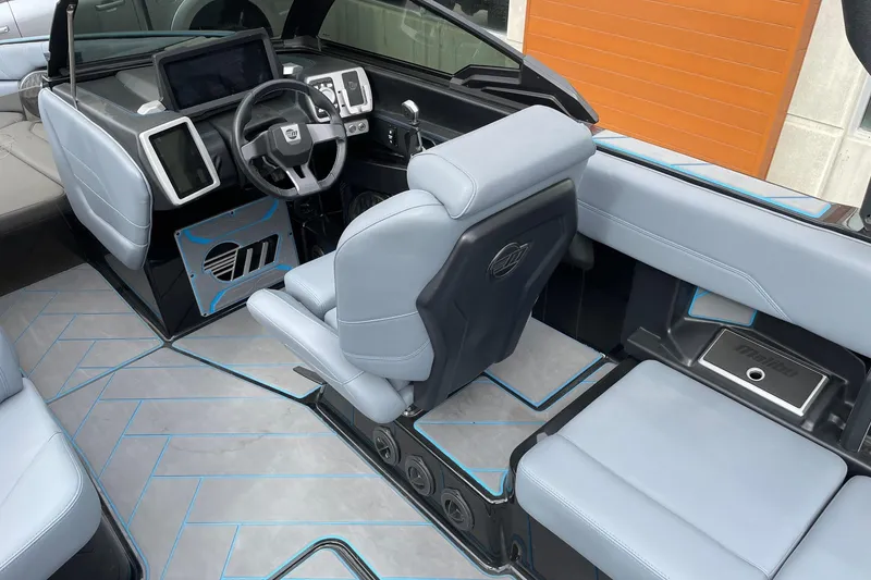 Slide: The Image of 2024 Malibu Wakesetter 26 LSV interior with modern dashboard and seating. - 7