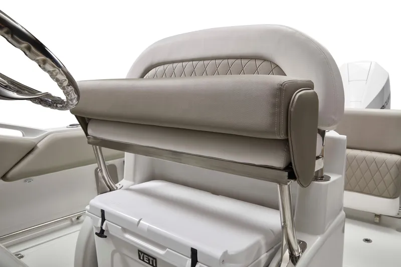 Slide: The Image of 2024 Finseeker 220 CC boat interior with cushioned seating and steering wheel. - 8