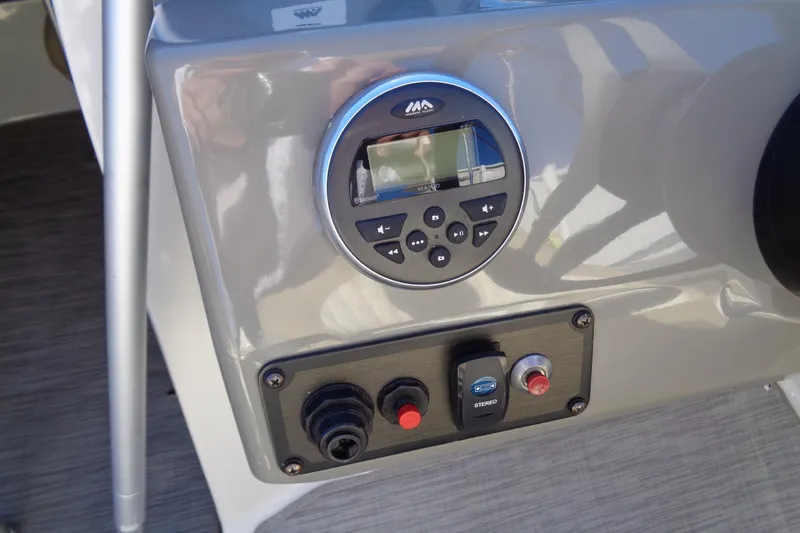 Slide: The Image of Control panel of a 2016 Stingray 192 SC boat with stereo system. - 15