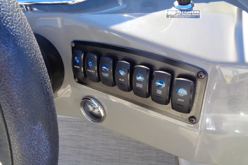 Slide: The Image of Control panel of a 2016 Stingray 192 SC boat with labeled switches. - 16