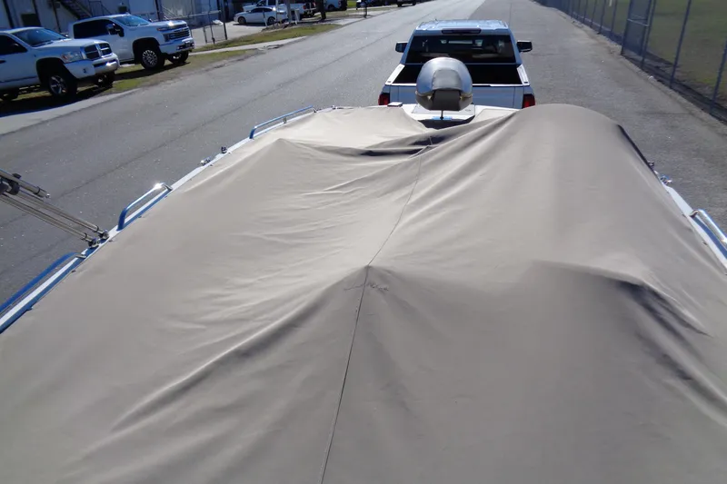 Slide: The Image of Covered 2016 Stingray 192 SC boat on trailer, parked on street. - 24
