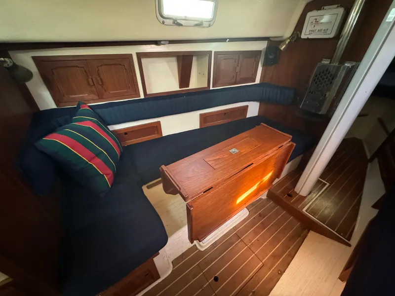 Slide: The Image of Interior of a 1990 Contessa 32 yacht with wooden furnishings. - 15