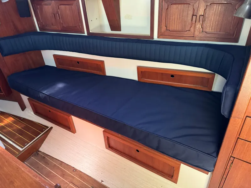 Slide: The Image of Interior of a 1990 Contessa 32 yacht with blue upholstery. - 17