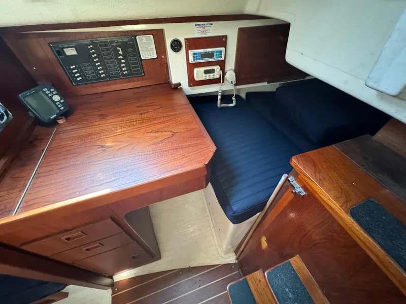 Slide: The Image of Interior of a 1990 Contessa 32 yacht with wooden furnishings. - 19