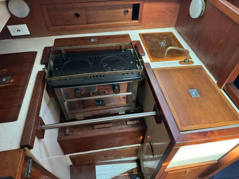 Slide: The Image of Galley area of a 1990 Contessa 32 yacht with stove and sink. - 22