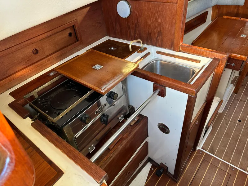 Slide: The Image of Galley area of a 1990 Contessa 32 yacht with wood finish. - 24