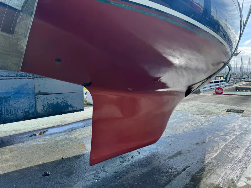 Slide: The Image of Hull of a 1990 Contessa 32 sailboat in dry dock. - 31