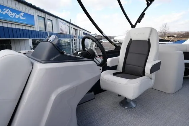 Slide: The Image of 2026 Harris Cruiser 230 boat interior with modern helm and comfortable captain's chair. - 15