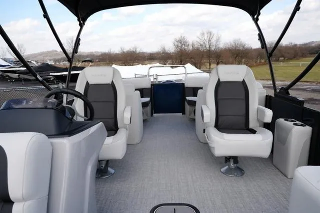 Slide: The Image of 2026 Harris Cruiser 230 pontoon boat interior with plush seating and modern design. - 16