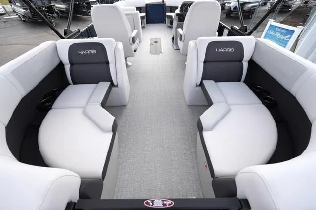 Slide: The Image of 2026 Harris Cruiser 230 pontoon boat interior with plush seating and modern design. - 19