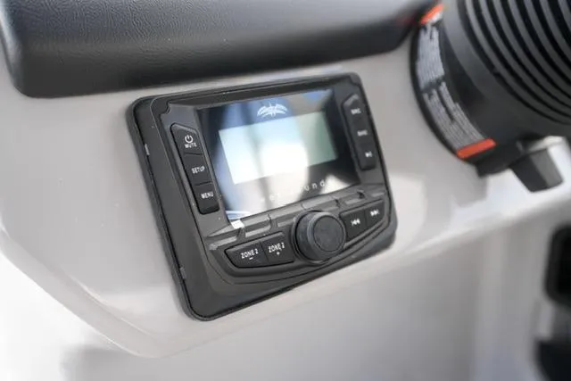 Slide: The Image of 2026 Harris Cruiser 230 dashboard with control panel and display screen. - 21