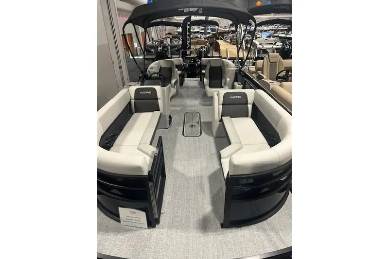 Slide: The Image of 2026 Harris Cruiser 230 pontoon boat with spacious seating and modern design. - 3