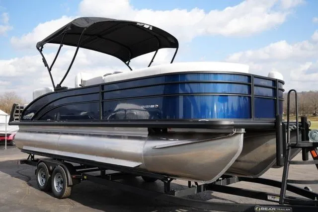 Slide: The Image of 2026 Harris Cruiser 230 pontoon boat on trailer, featuring sleek design and canopy. - 9