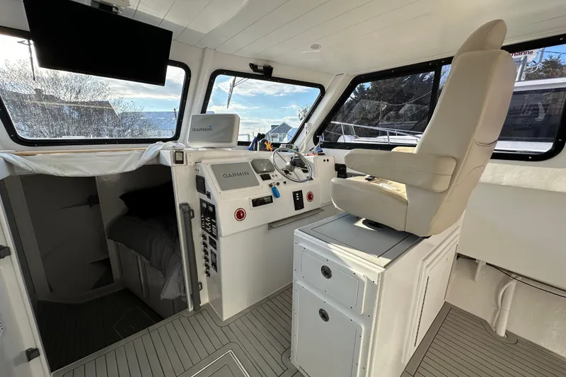 Slide: The Image of Interior of 2005 Evans 38 Chesapeake Bay Boat with helm, Garmin navigation, and captain's chair. - 10
