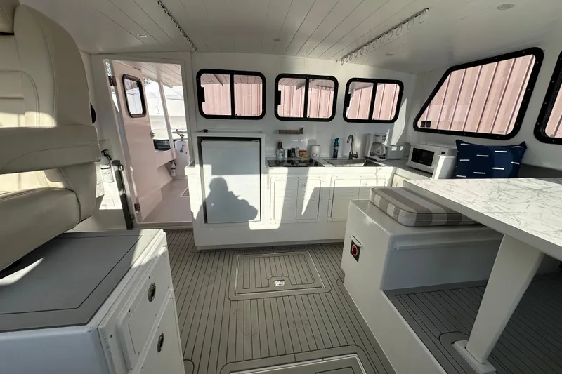 Slide: The Image of Interior of 2005 Evans 38 Chesapeake Bay Boat with modern kitchen and seating area. - 11