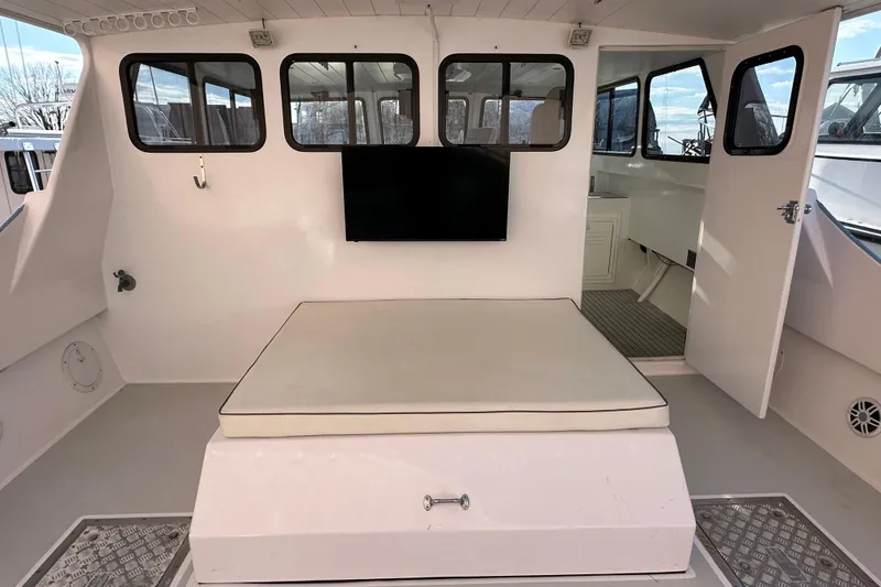 Slide: The Image of 2005 Evans 38 Chesapeake Bay Boat interior with seating and windows. - 16