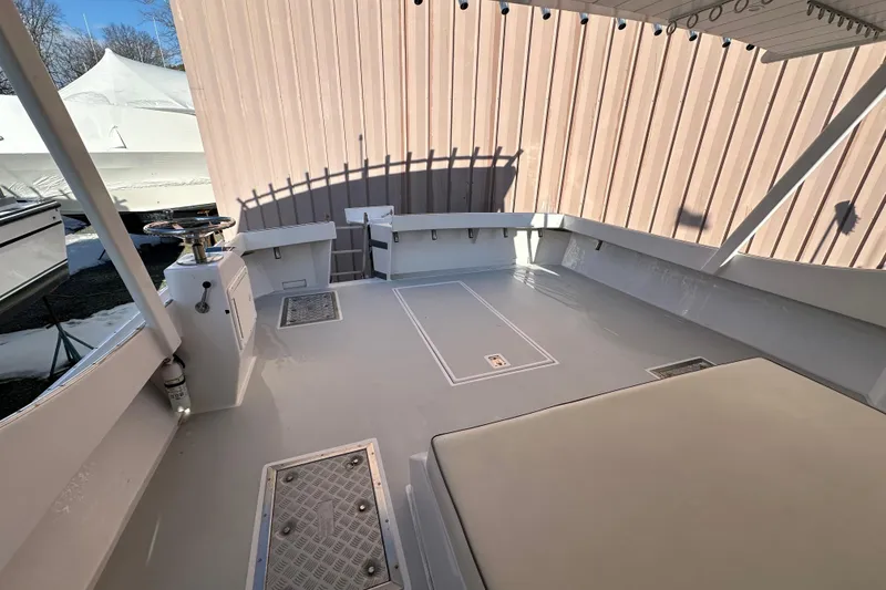 Slide: The Image of 2005 Evans 38 Chesapeake Bay Boat deck with seating and storage compartments. - 19