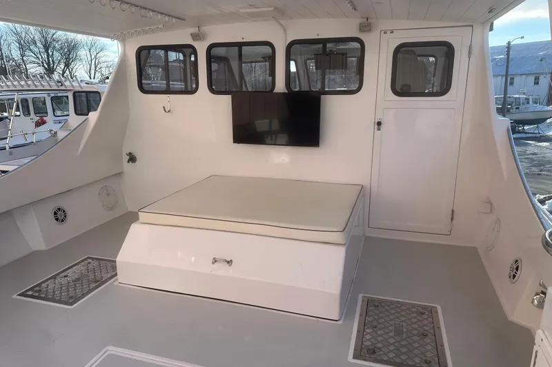 Slide: The Image of 2005 Evans 38 Chesapeake Bay Boat interior with seating and windows. - 6