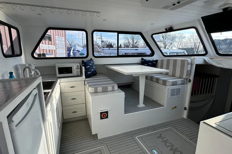 Slide: The Image of Interior of 2005 Evans 38 Chesapeake Bay Boat with kitchenette and seating area. - 8