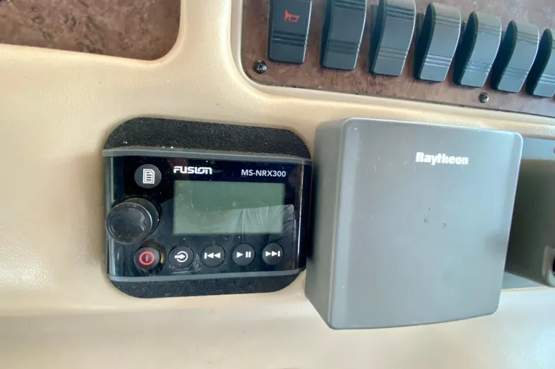 Slide: The Image of Fusion MS-NRX300 and Raytheon equipment on 1998 Sea Ray Sundancer 310 dashboard. - 12