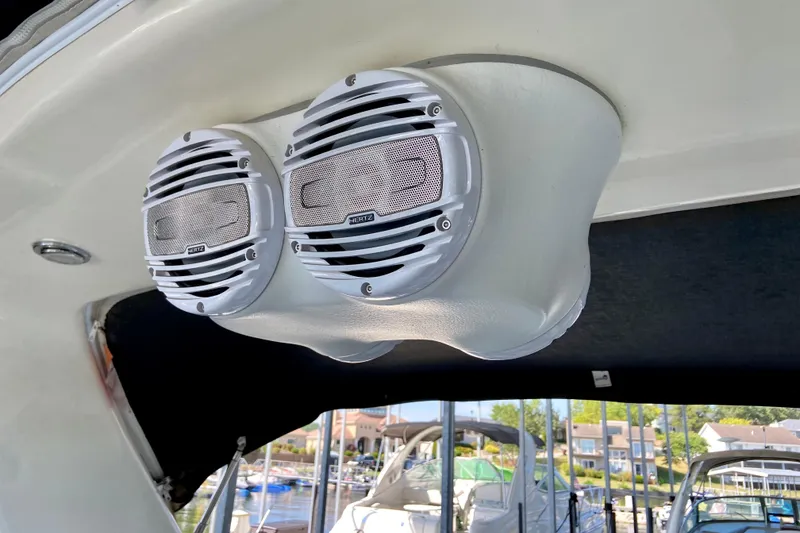 Slide: The Image of Speakers on a 1998 Sea Ray Sundancer 310 boat, docked at a marina. - 24