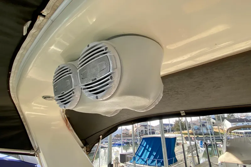 Slide: The Image of Speakers on a 1998 Sea Ray Sundancer 310 boat, docked at a marina. - 30