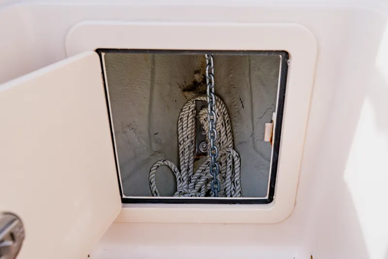 Slide: The Image of Anchor storage compartment on 2021 Grady-White Canyon 306 boat. - 12