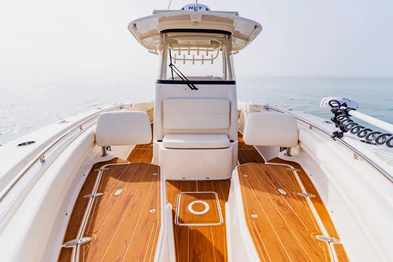 Slide: The Image of 2021 Grady-White Canyon 306 boat interior with teak flooring and seating. - 16