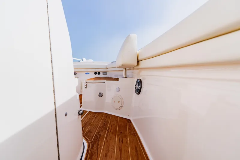 Slide: The Image of 2021 Grady-White Canyon 306 boat interior with wooden flooring and seating. - 20