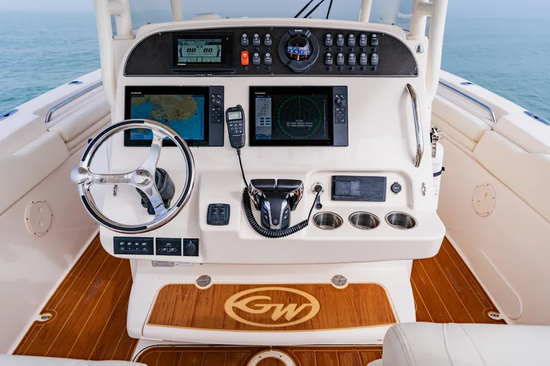 Slide: The Image of 2021 Grady-White Canyon 306 helm with advanced navigation and control systems. - 22