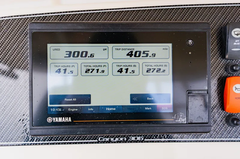 Slide: The Image of Yamaha display on 2021 Grady-White Canyon 306 showing fuel and trip data. - 25