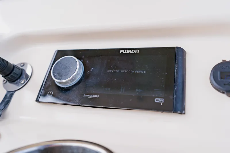 Slide: The Image of Fusion audio system on 2021 Grady-White Canyon 306 boat dashboard. - 26