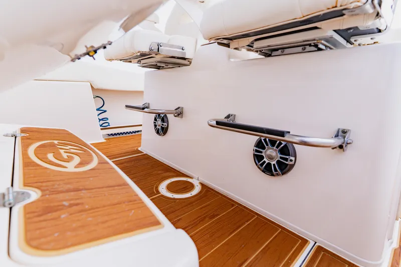 Slide: The Image of 2021 Grady-White Canyon 306 boat interior with teak flooring and seating. - 31