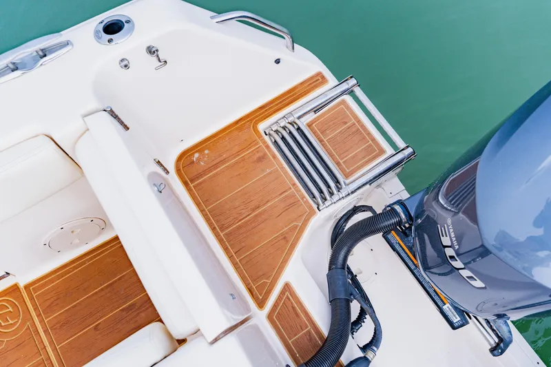 Slide: The Image of 2021 Grady-White Canyon 306 boat with teak deck and Yamaha outboard motor. - 44