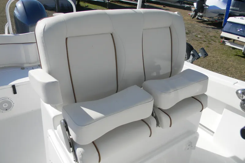 Slide: The Image of 2022 Sea Hunt Ultra 234 boat seats, white leather with brown accents, dual seating. - 11