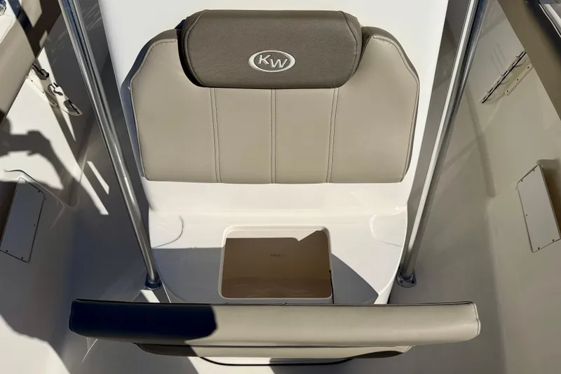 Slide: The Image of 2023 Key West 239 FS boat seat with KW logo, beige upholstery. - 13