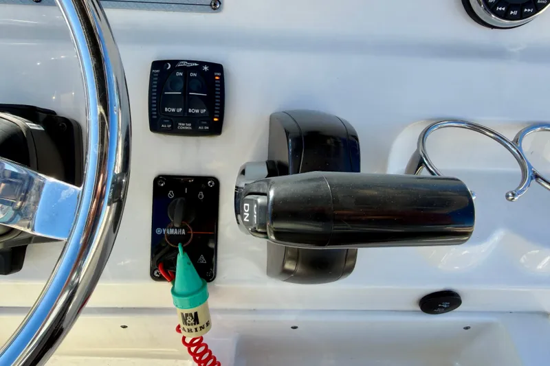 Slide: The Image of 2023 Key West 239 FS boat controls with Yamaha throttle and steering wheel. - 18