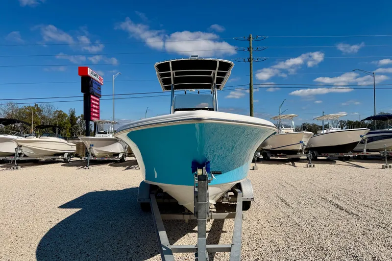 Slide: The Image of 2023 Key West 239 FS boat on display under clear blue sky. - 2
