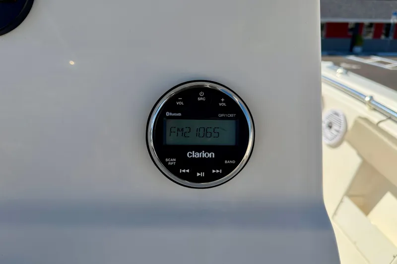 Slide: The Image of Clarion radio display on 2023 Key West 239 FS boat, showing FM 106.5. - 21