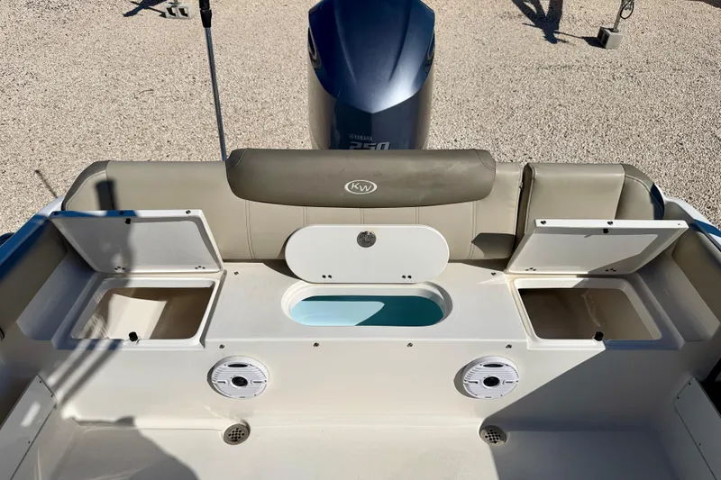 Slide: The Image of 2023 Key West 239 FS boat interior with storage compartments and seating. - 28