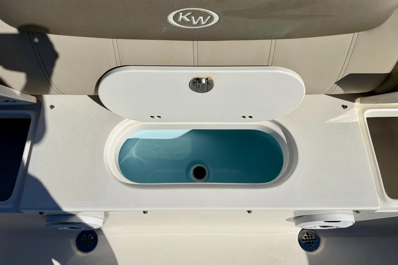 Slide: The Image of 2023 Key West 239 FS boat livewell with open lid, showcasing interior. - 29