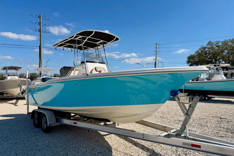 Slide: The Image of 2023 Key West 239 FS boat on trailer, vibrant blue hull, sunny day. - 3