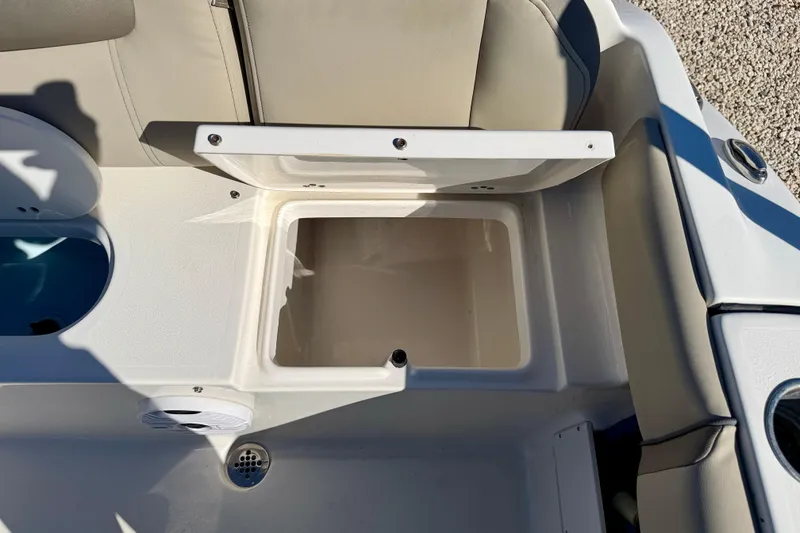 Slide: The Image of 2023 Key West 239 FS boat interior storage compartment with open lid. - 31