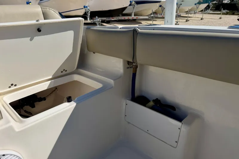 Slide: The Image of 2023 Key West 239 FS boat interior with open storage compartments. - 32