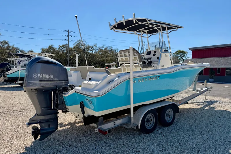Slide: The Image of 2023 Key West 239 FS boat on trailer with Yamaha outboard motor. - 5