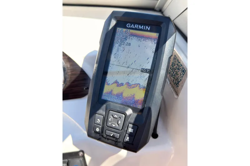 Slide: The Image of Garmin fishfinder on 2003 Crownline 180 BR boat dashboard. - 11