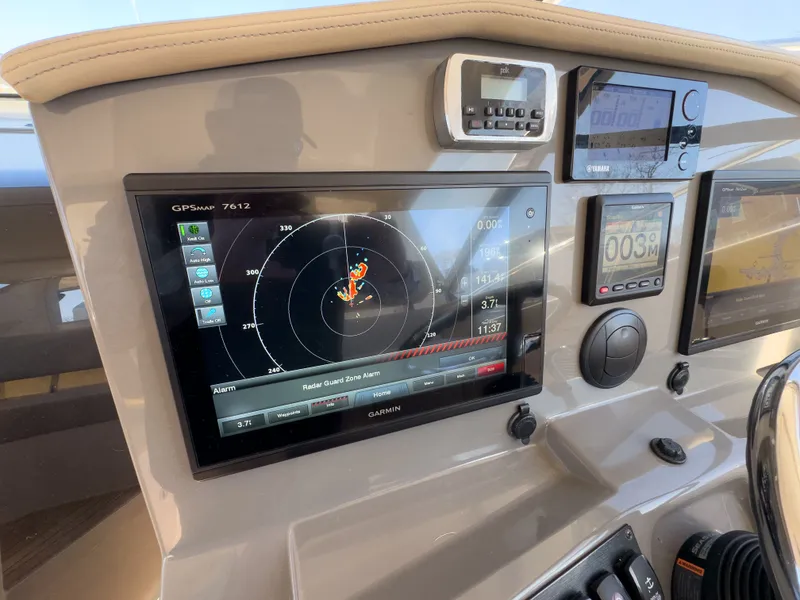Slide: The Image of Dashboard of 2015 Pursuit SC 365i Sport Coupe with Garmin GPS display. - 14